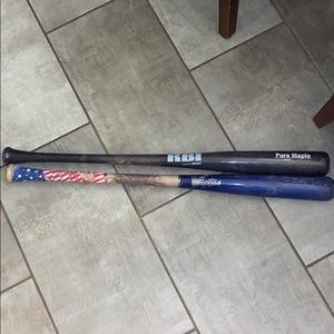 2 wooden baseball bats. Victis, and RBI